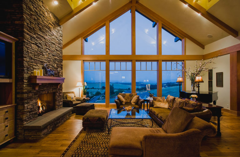 living room, picture window, stone fireplace, hardwood floor, window grills