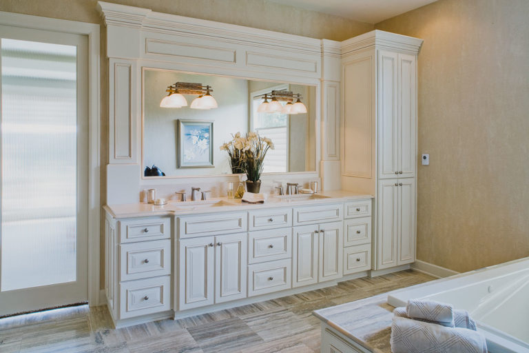 Master bath, Travertine tile floor, Quartz counter, mirror, vanity lighting, reeded glass door