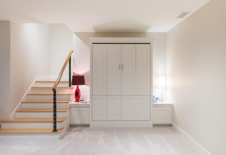 A sleek Murphy bed concealed within custom cabinetry, offering a clean and functional design for modern living.